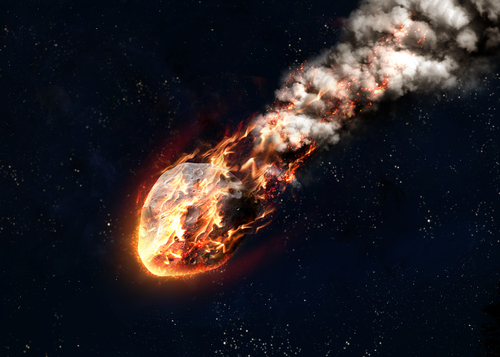 A blazing meteor streaks through space.