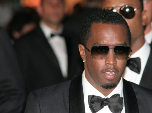 Man in suit and sunglasses at formal event