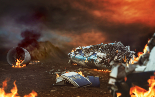 Burning airplane wreckage scattered across a desolate landscape.