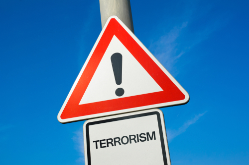 Warning sign with exclamation mark and text Terrorism